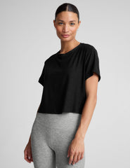 black relaxed fit cropped tee with a scoop neckline.