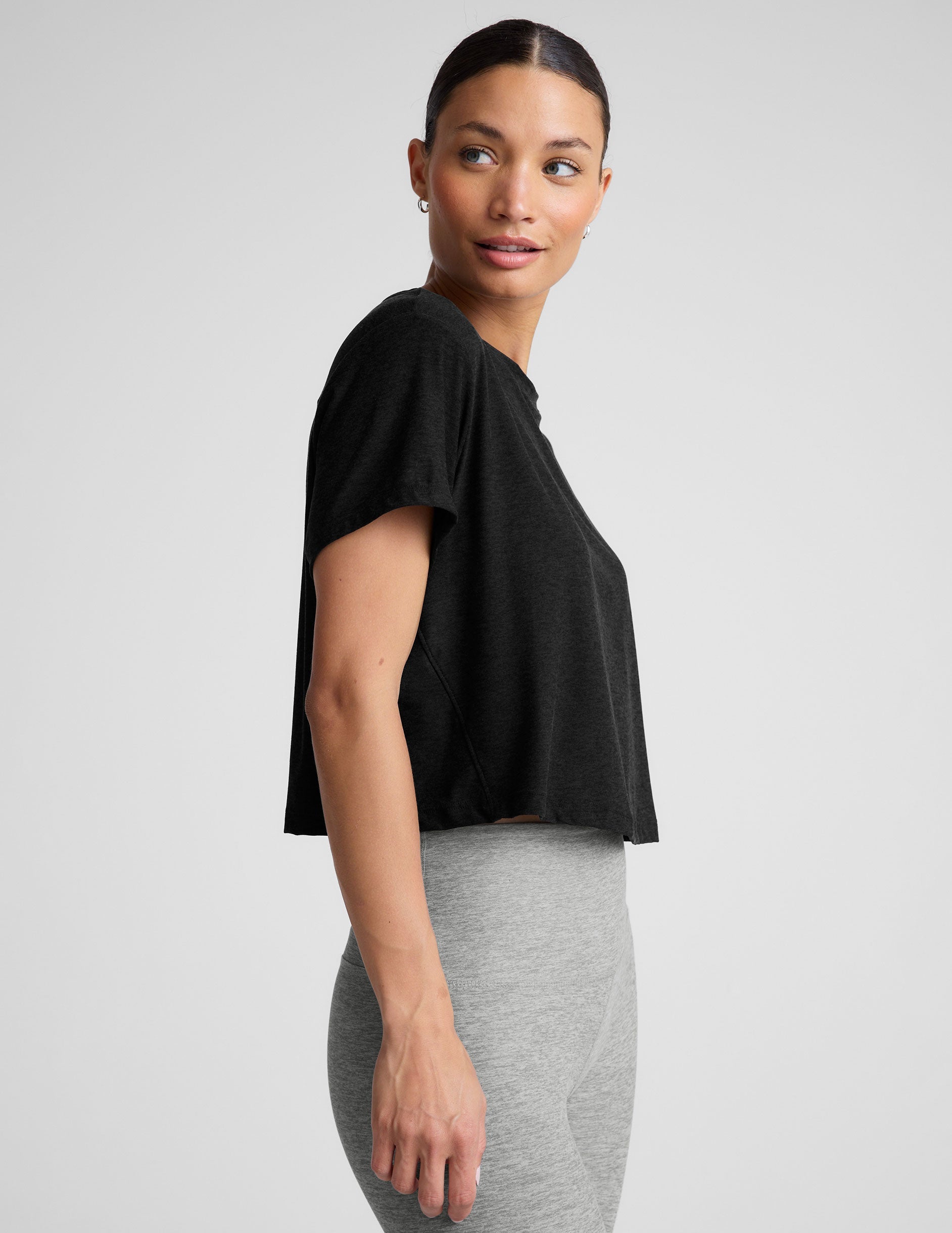 black relaxed fit cropped tee with a scoop neckline.