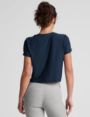blue short sleeve cropped t-shirt with a scooped neckline.