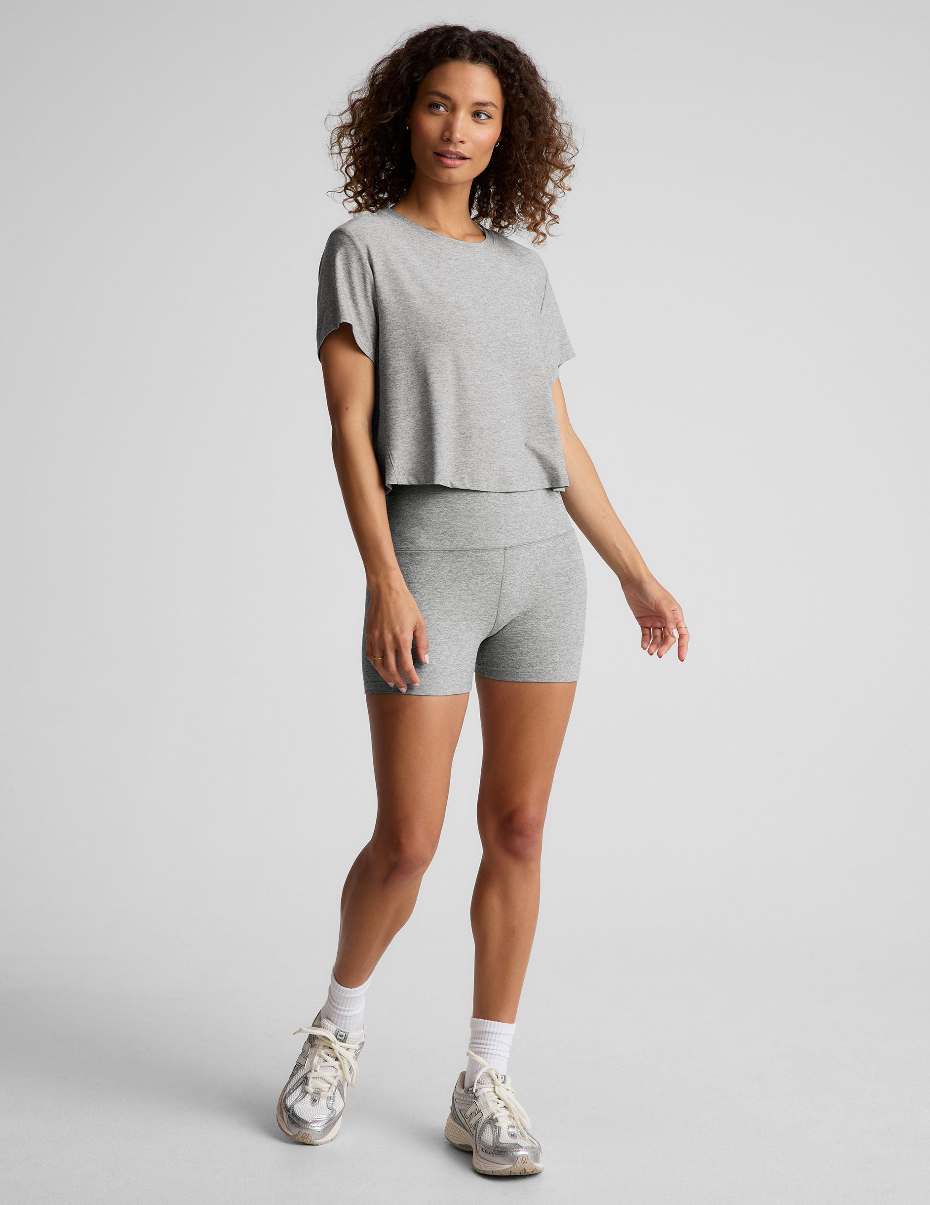 gray short sleeve loose-fitting cropped tee with a scoop neckline.