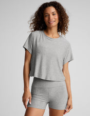 gray short sleeve loose-fitting cropped tee with a scoop neckline.