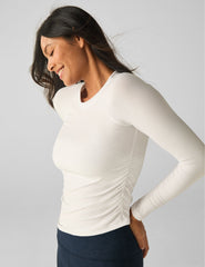 white long sleeve top.