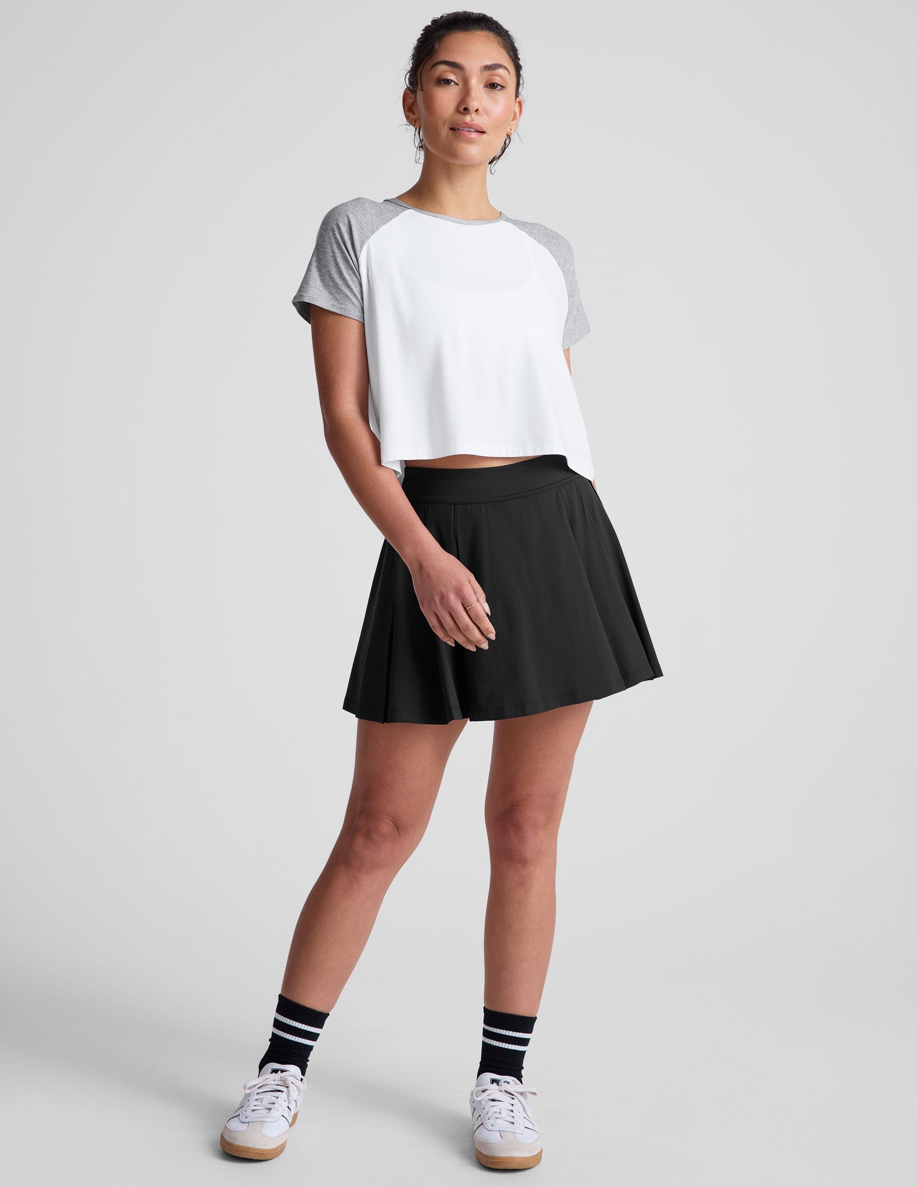 white relaxed fit t-shirt with colorblock raglan sleeve and neck binding​.