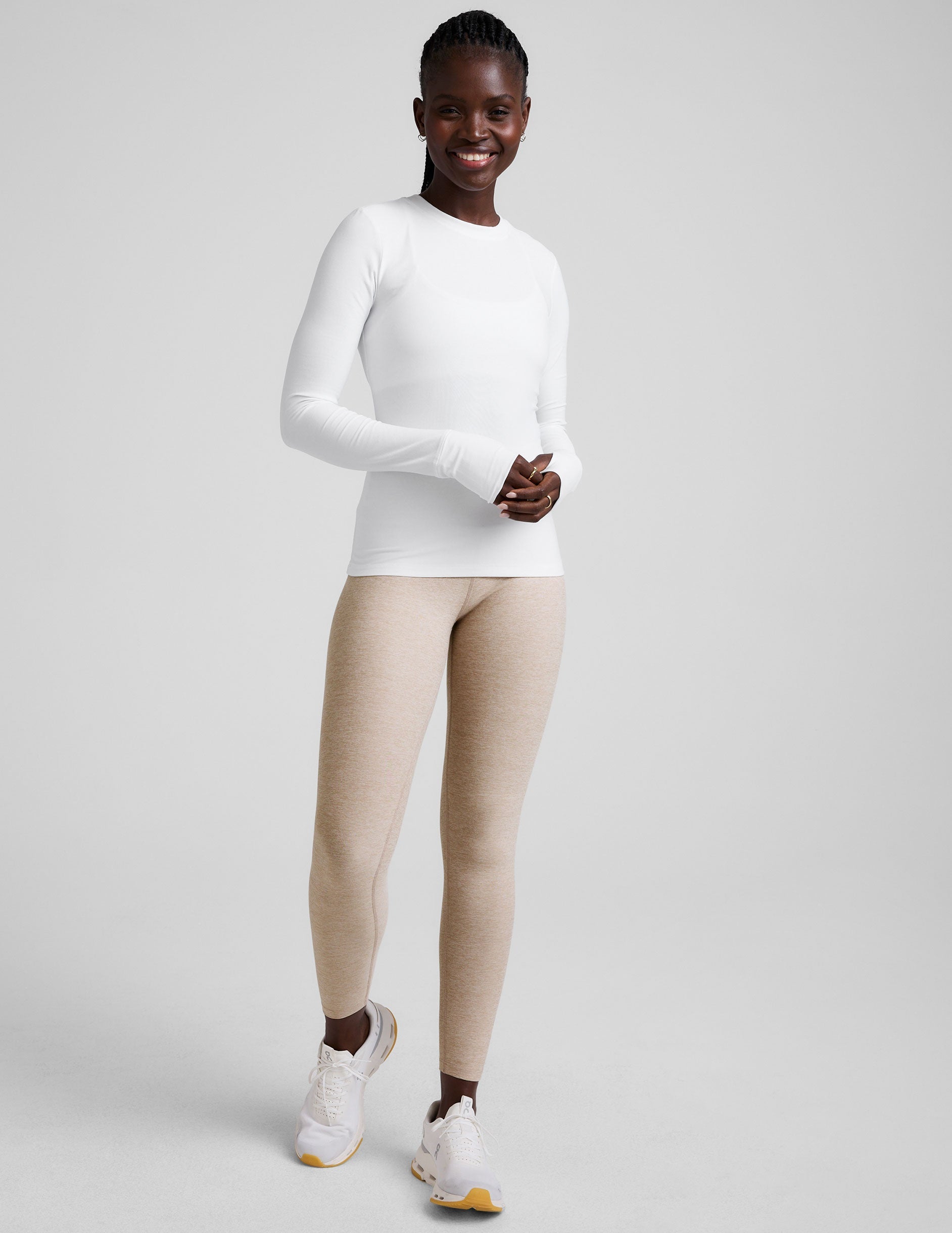 white crew neck long sleeve with thumb holes.