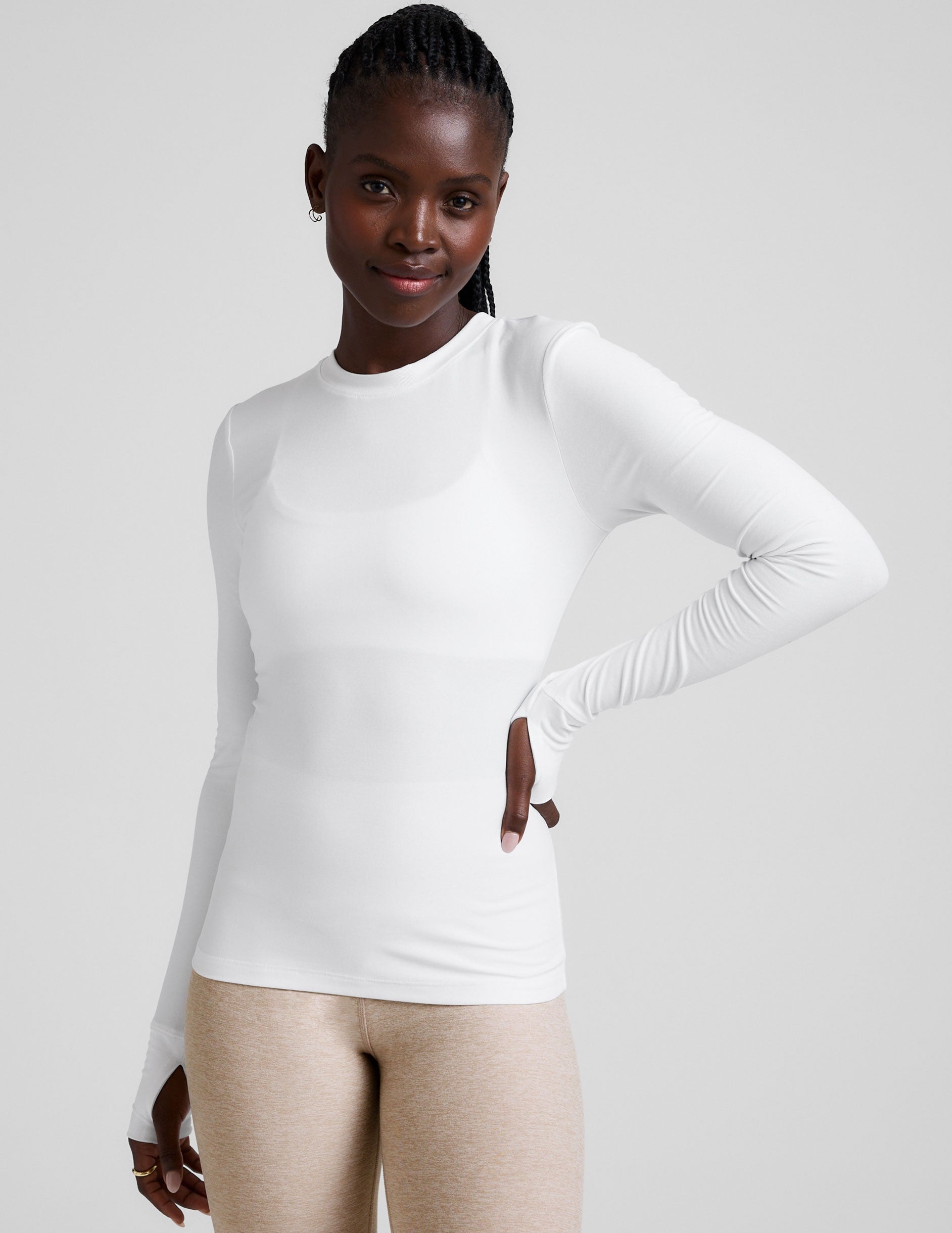 white crew neck long sleeve with thumb holes.