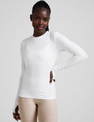 white crew neck long sleeve with thumb holes.