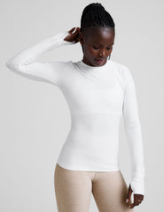 white crew neck long sleeve with thumb holes.