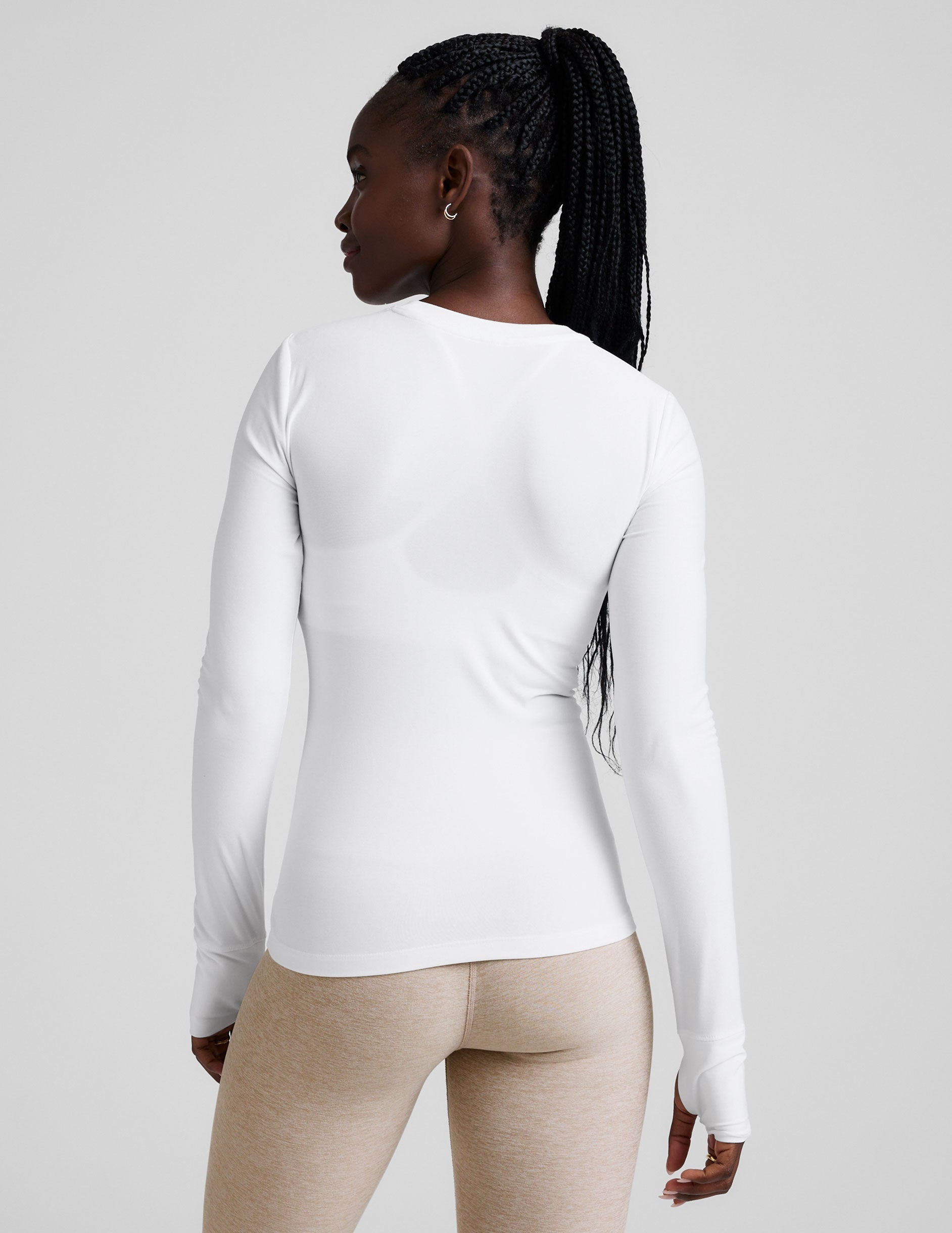 white crew neck long sleeve with thumb holes.