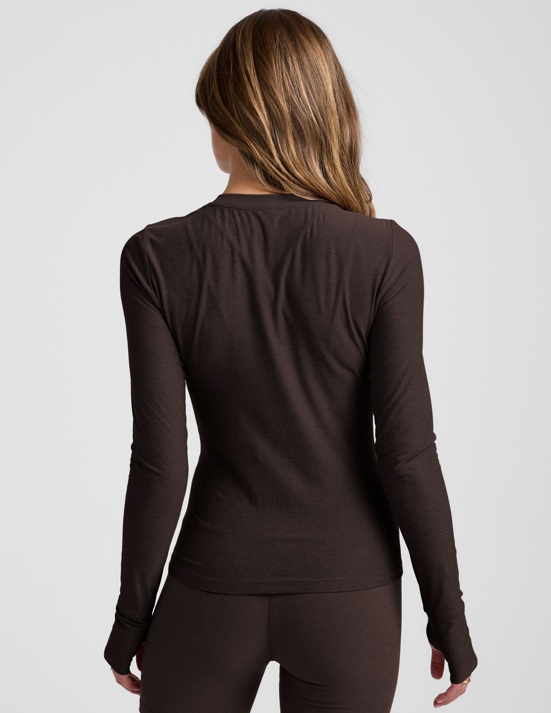 brown crew neck long sleeve with thumb holes.