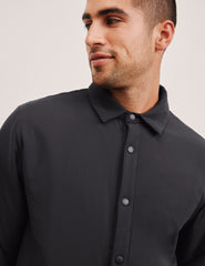 black men's button up insulated jacket with a shirt collar and side seam invisible zipper pockets.