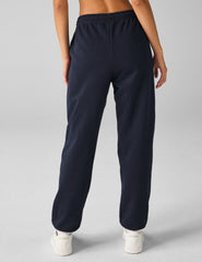blue jogger style sweatpants with pockets.