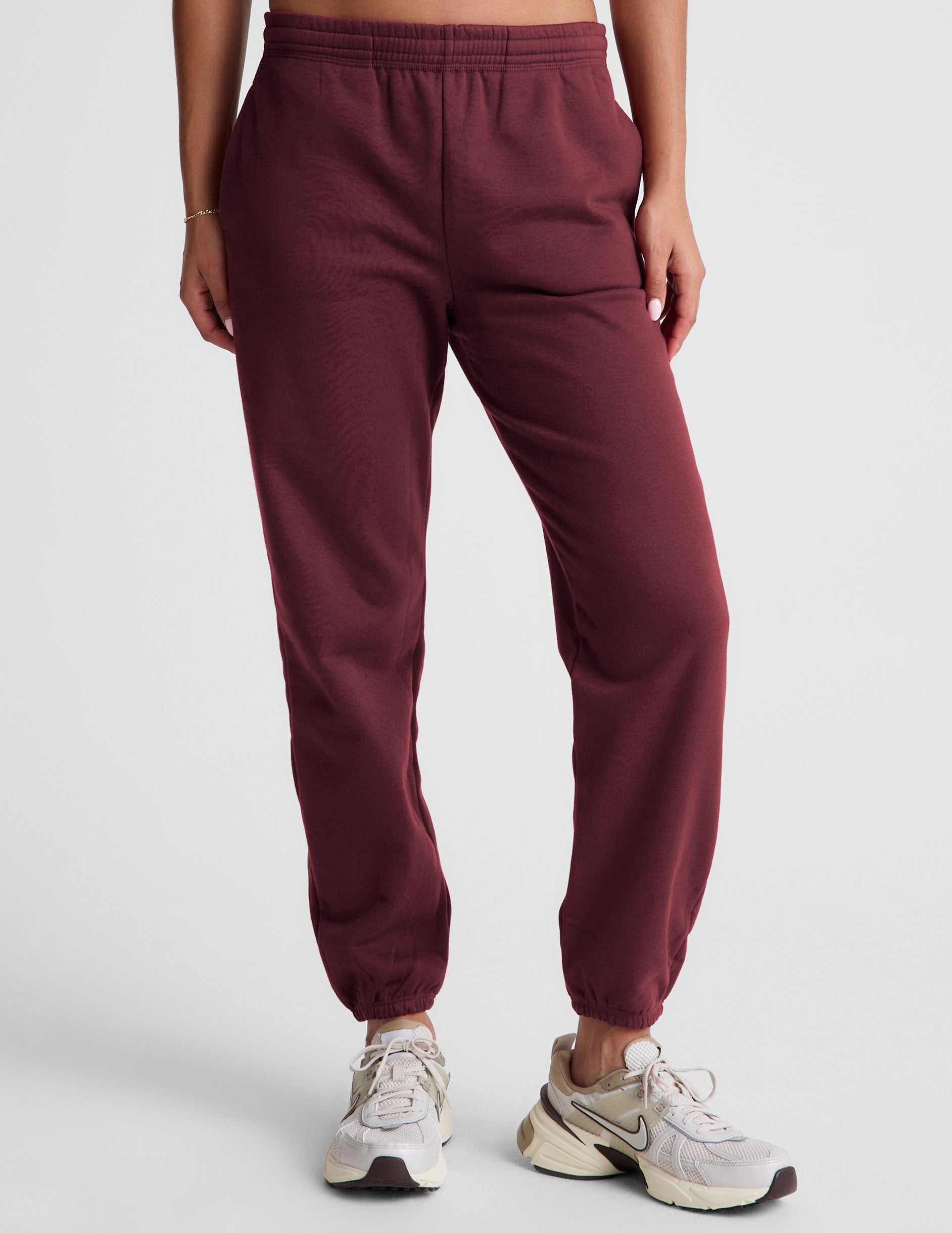 red sweatpants with pockets and a drawstring at waistband.