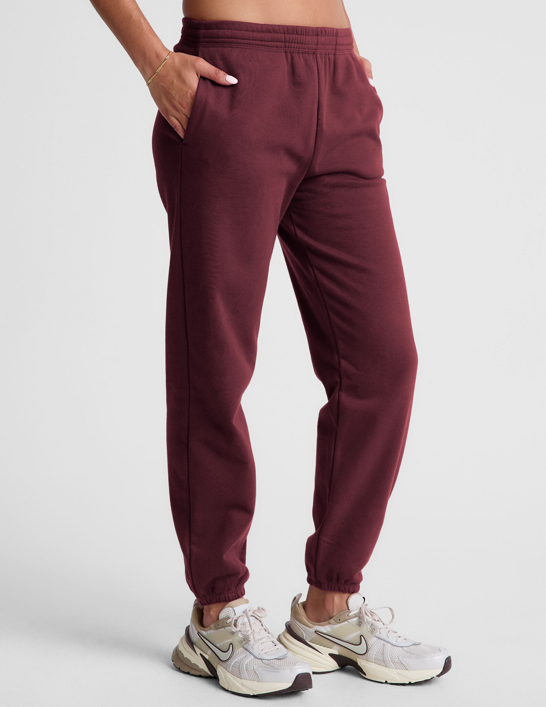 red sweatpants with pockets and a drawstring at waistband.