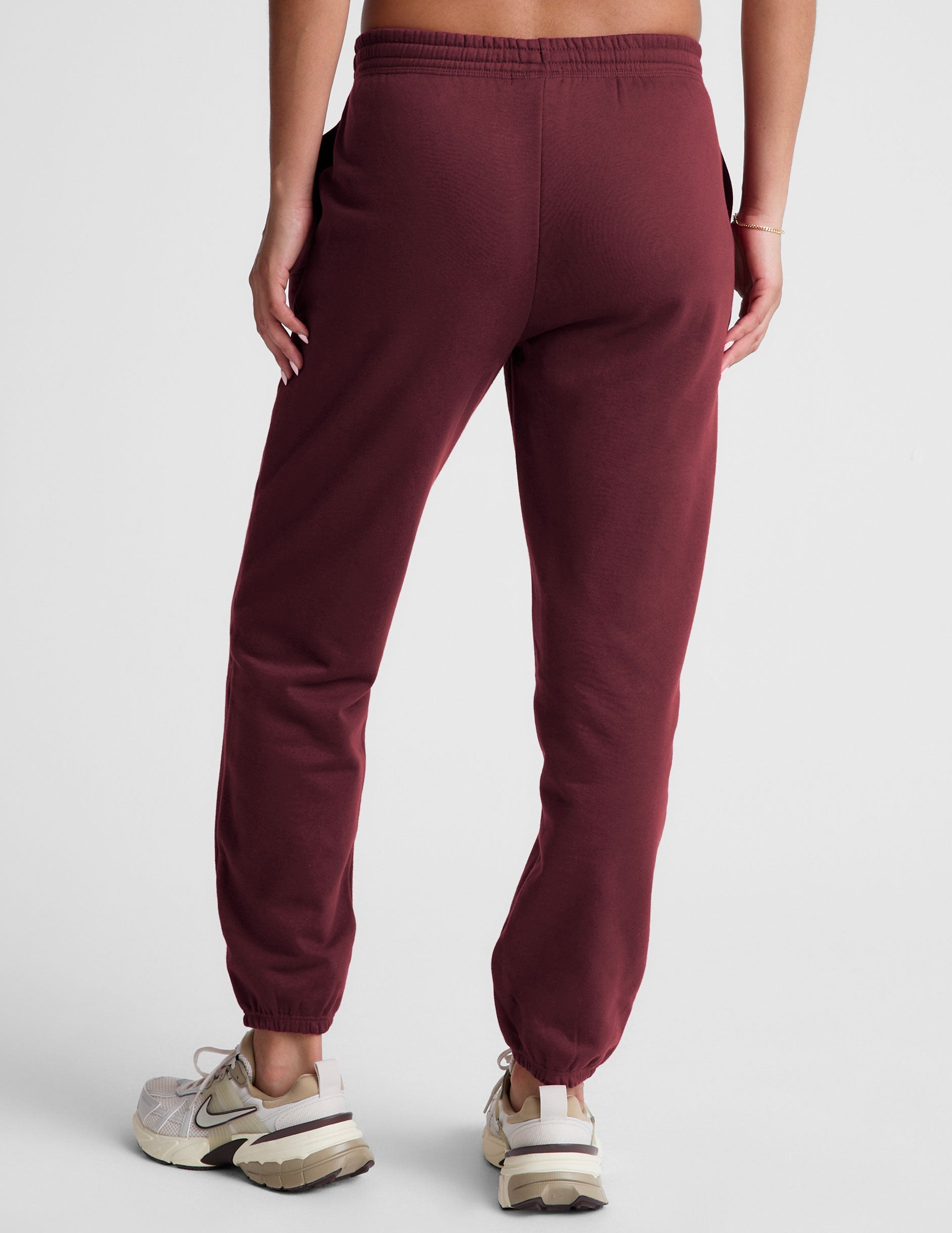 red sweatpants with pockets and a drawstring at waistband.