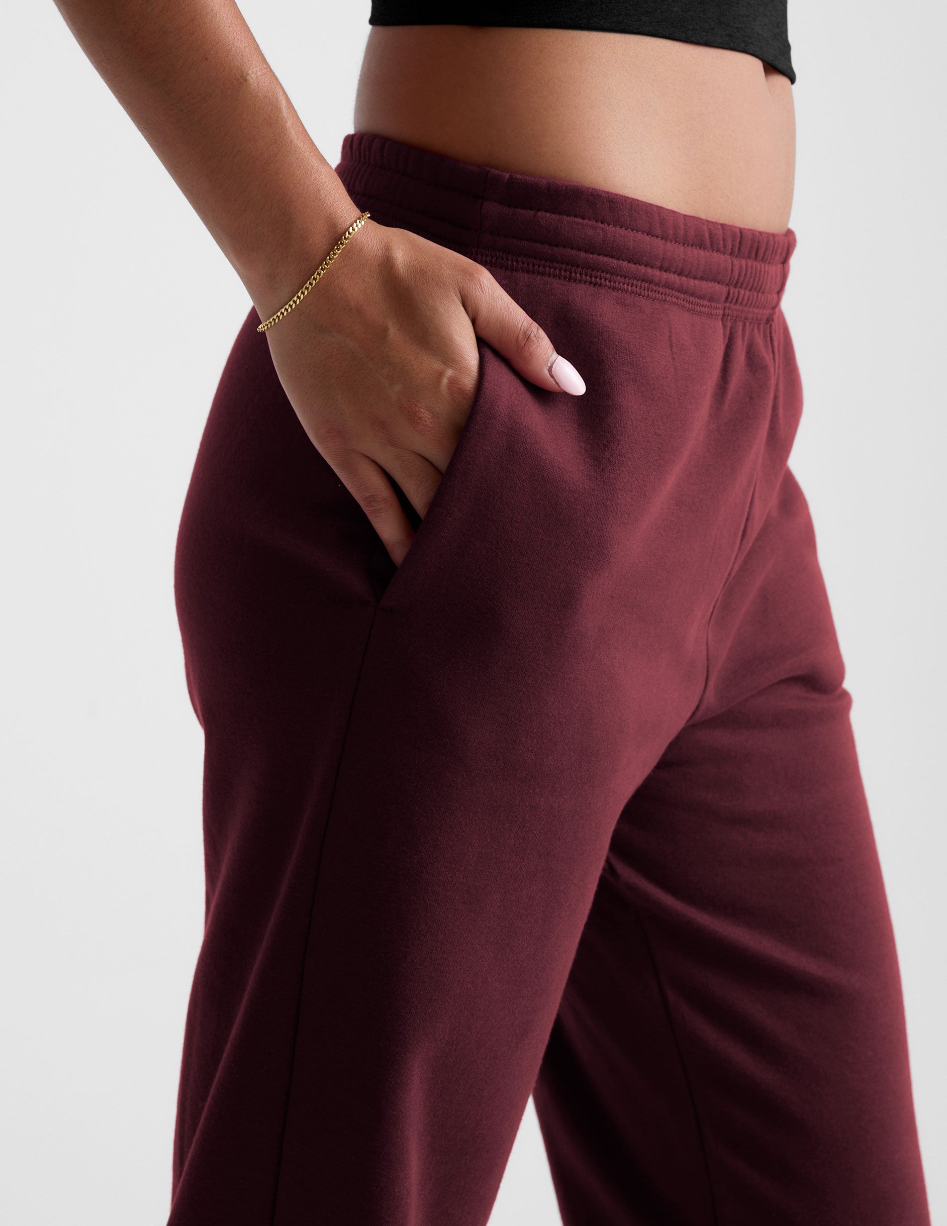 red sweatpants with pockets and a drawstring at waistband.