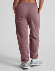 pink sweatpants with pockets and a drawstring at waistband.