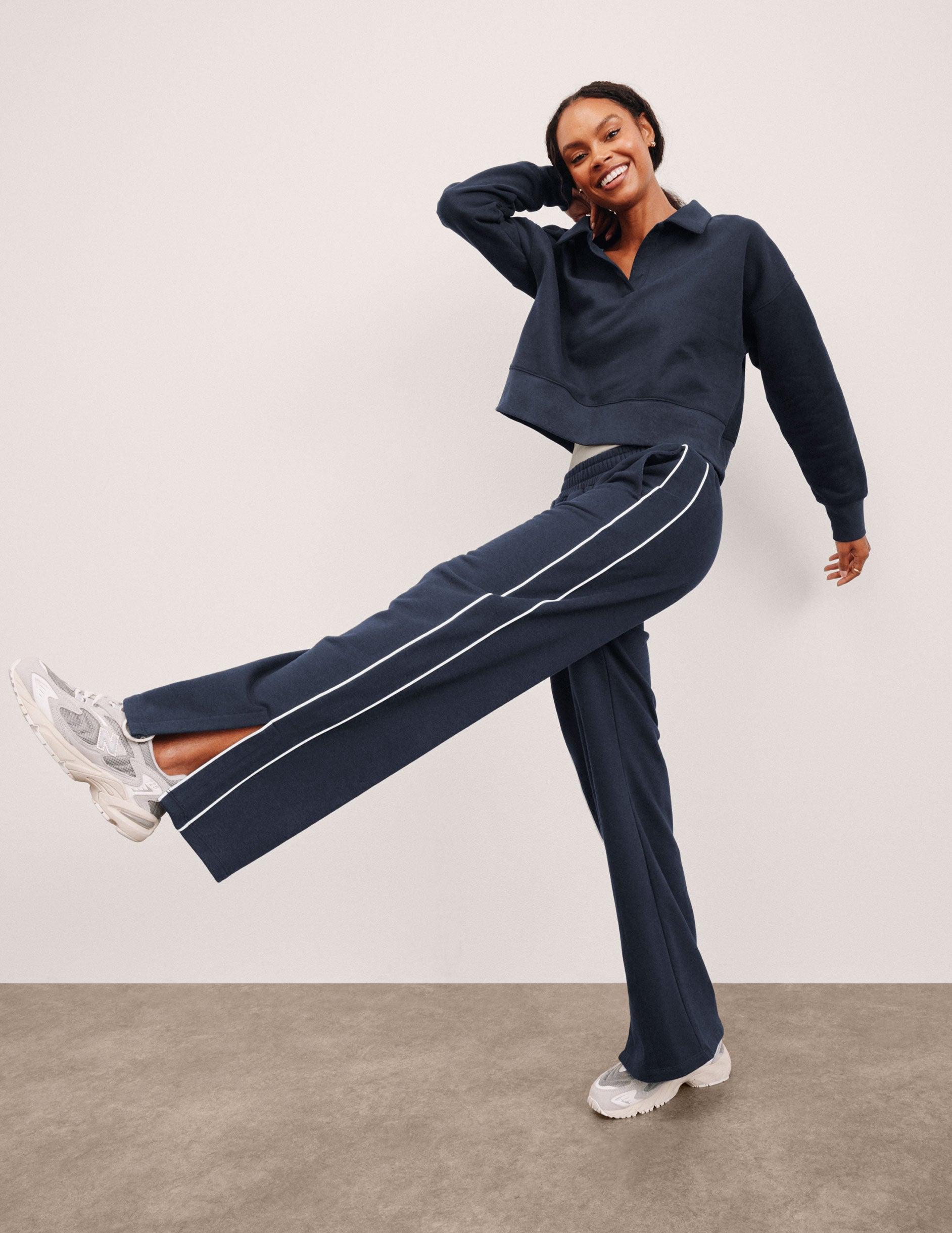 blue sweatpant with a mid rise elasticated waistband and contrast piping trim down sides of leg.