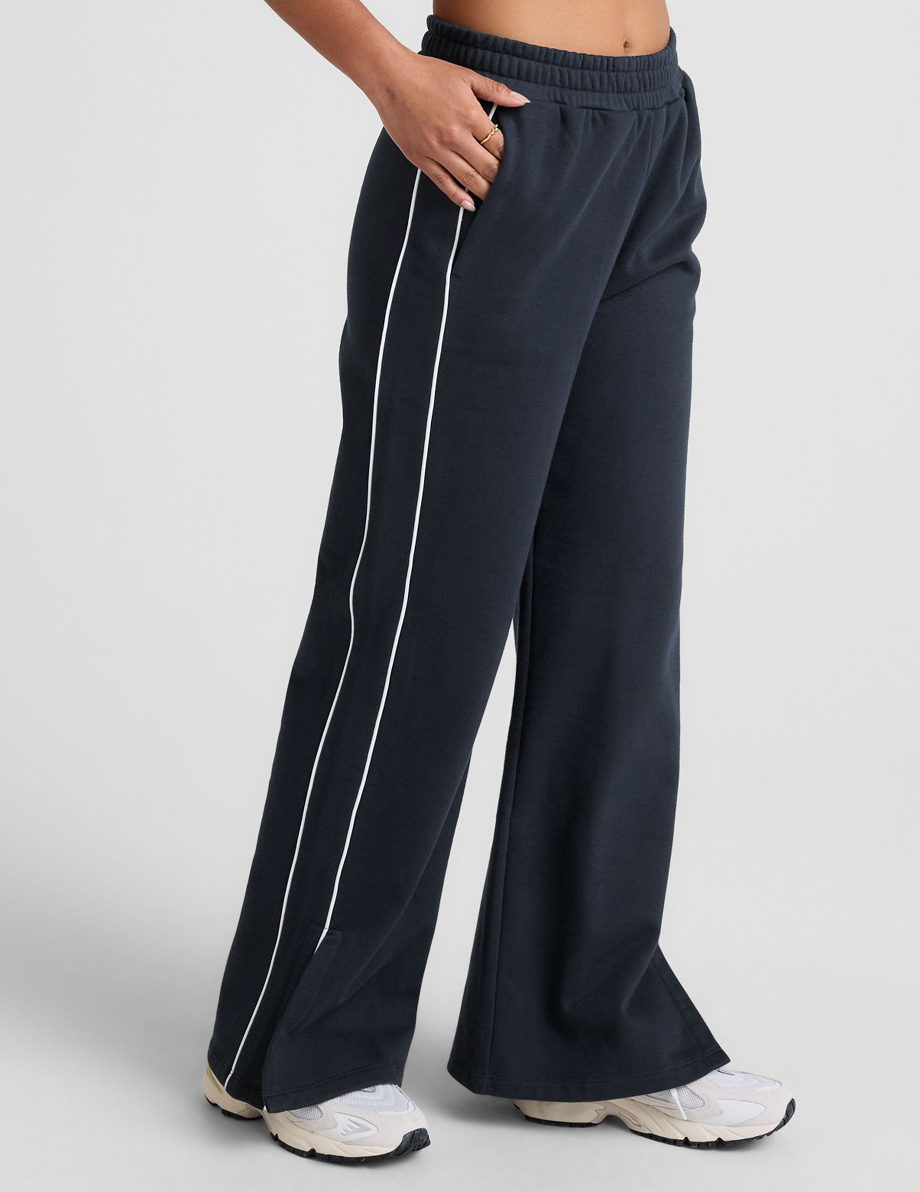 blue sweatpant with a mid rise elasticated waistband and contrast piping trim down sides of leg.