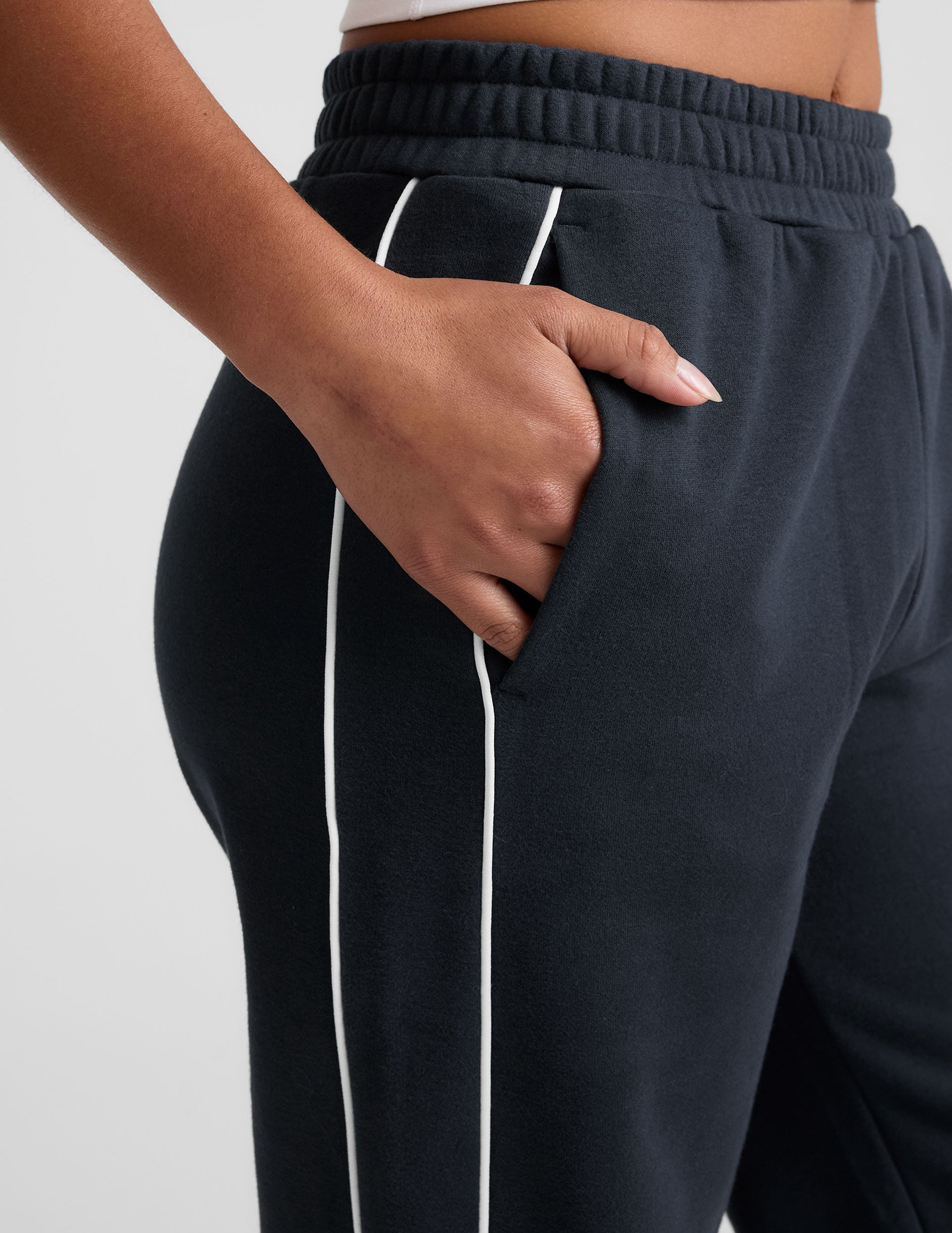 blue sweatpant with a mid rise elasticated waistband and contrast piping trim down sides of leg.