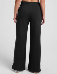 black mid-rise wide leg sweatpants with side slits and a drawcord at waistband.