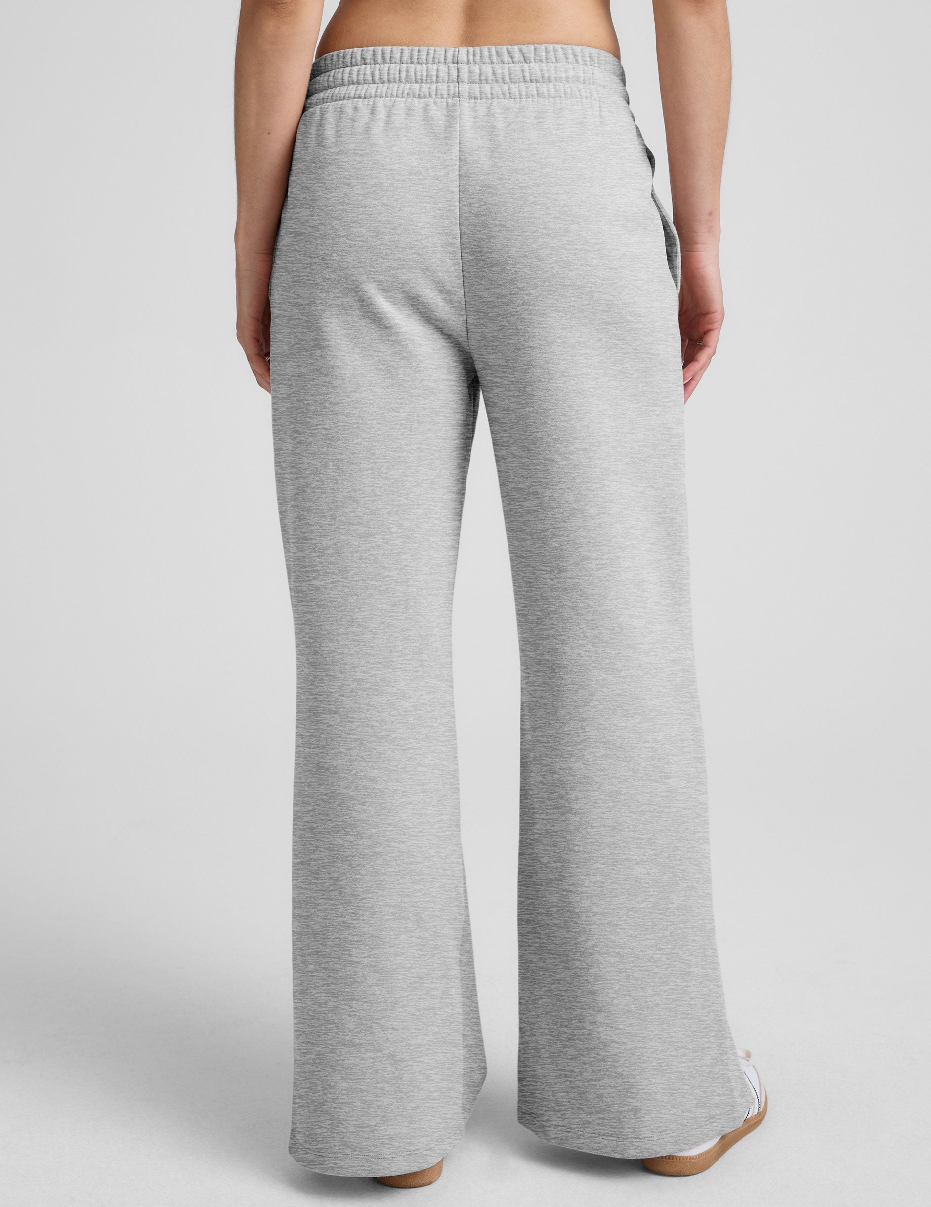 grey mid-rise wide leg sweatpants with side slits and a drawcord at waistband.