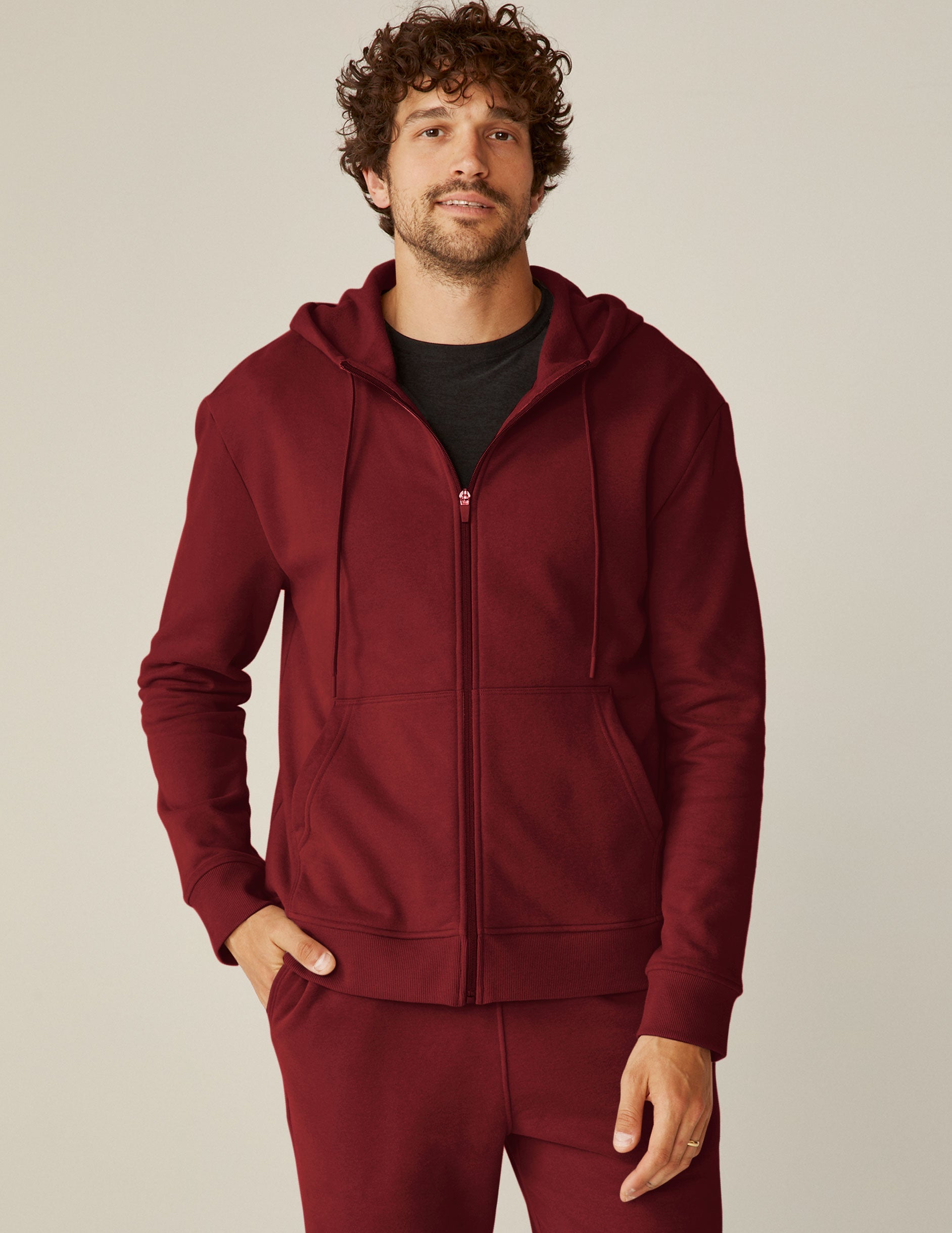red men's zip-up hooded jacket with pockets.