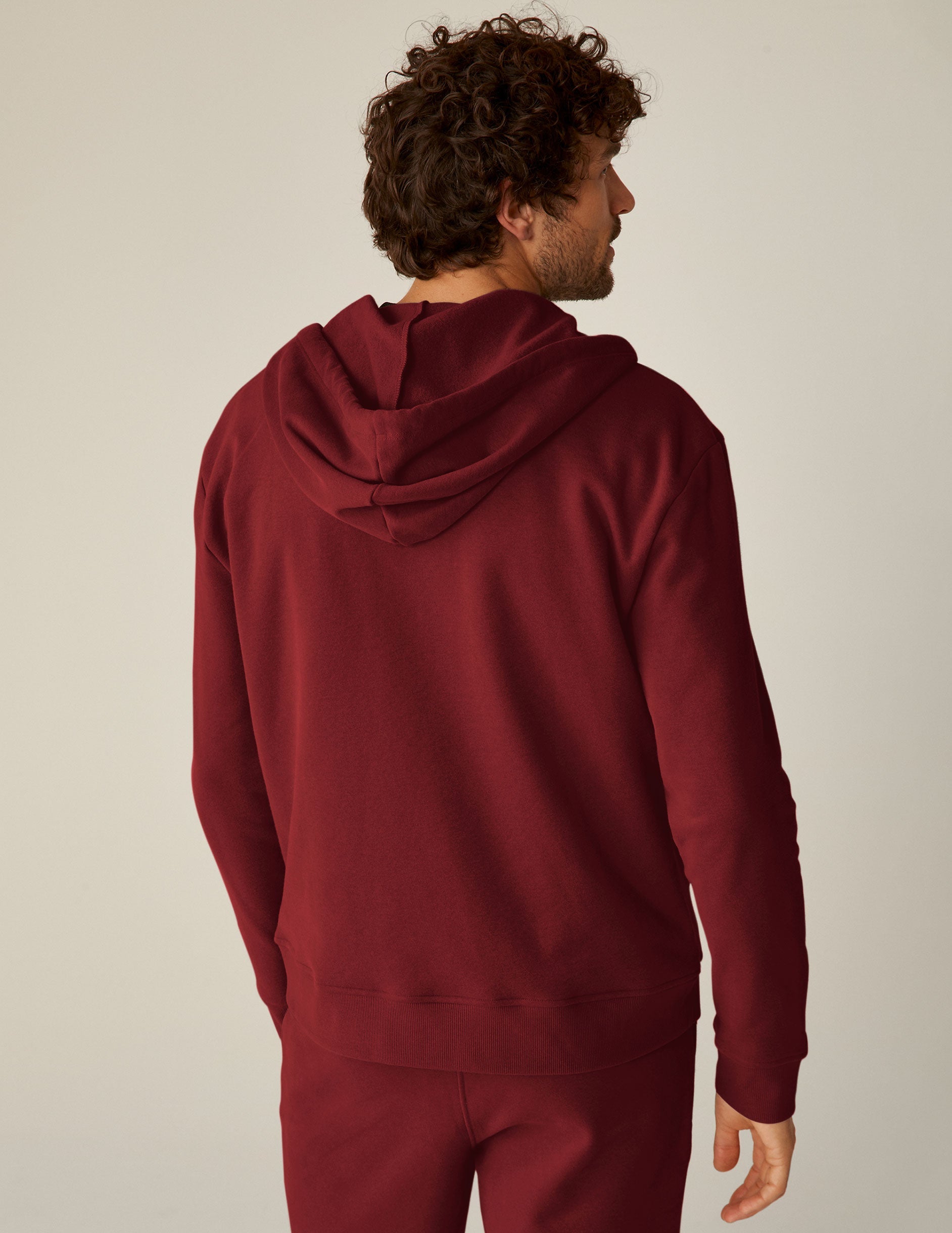 red men's zip-up hooded jacket with pockets.