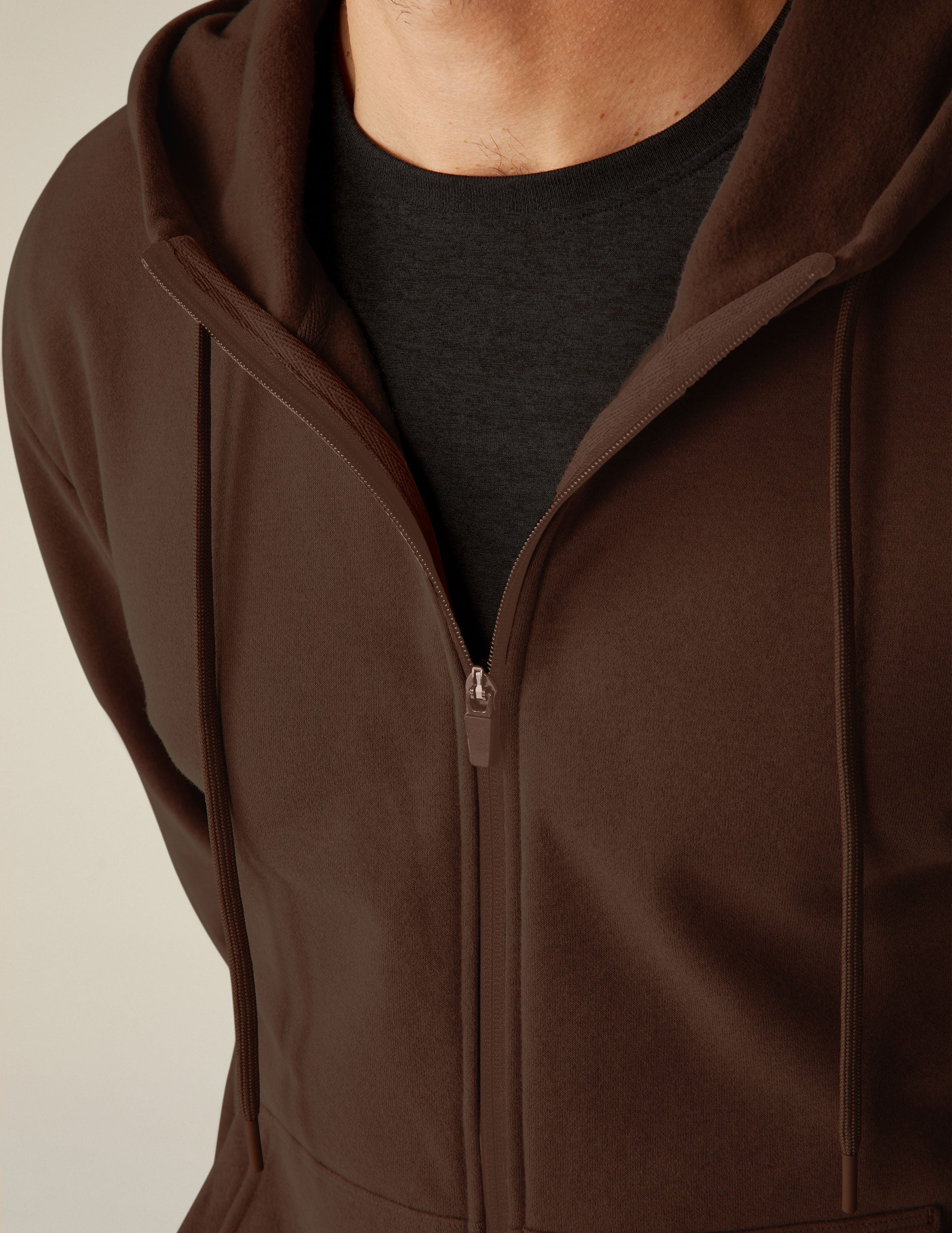 brown zip-up jacket with pockets and a hood.