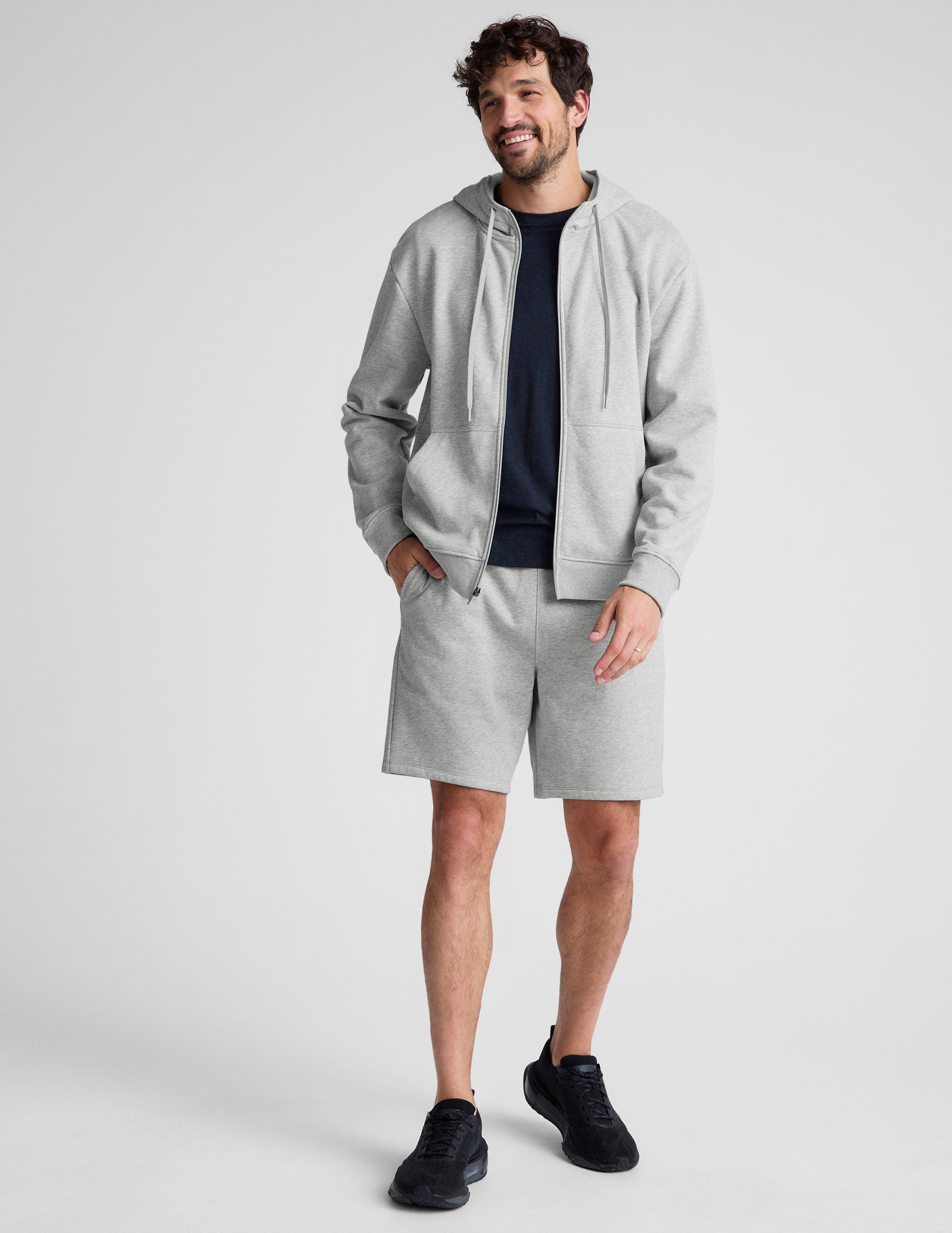 gray zip-up hooded jacket with pockets.