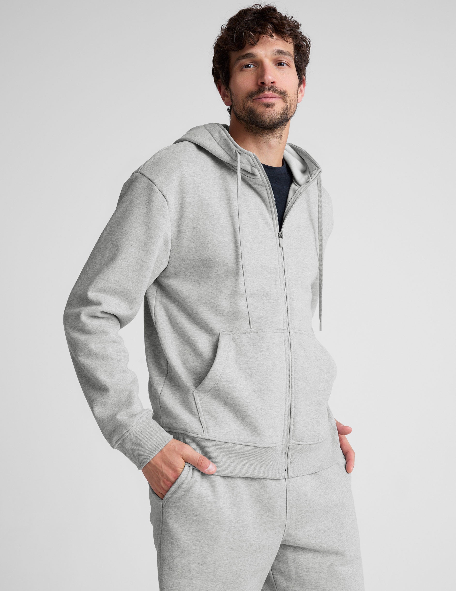 gray zip-up hooded jacket with pockets.