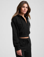 black fleece zip-up jacket with a drawstring hood.