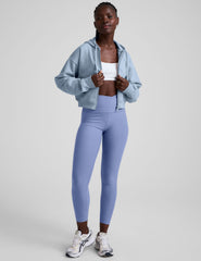 blue fleece zip-up jacket with a drawstring hood.