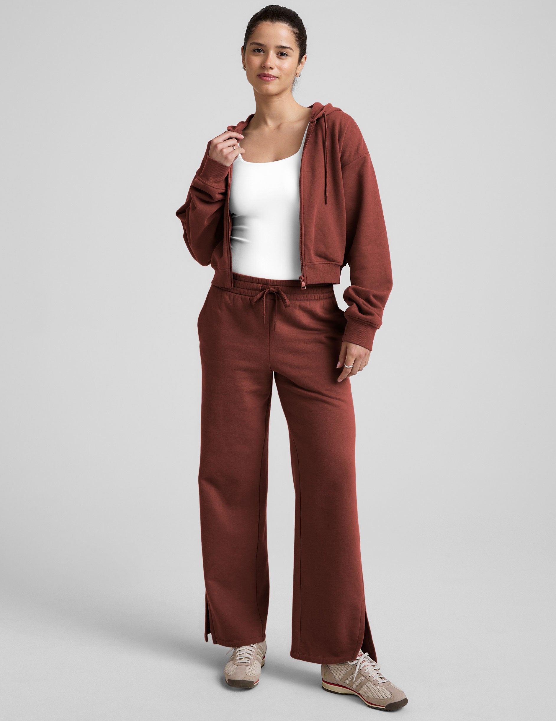 brown fleece zip-up jacket with a drawstring hood.