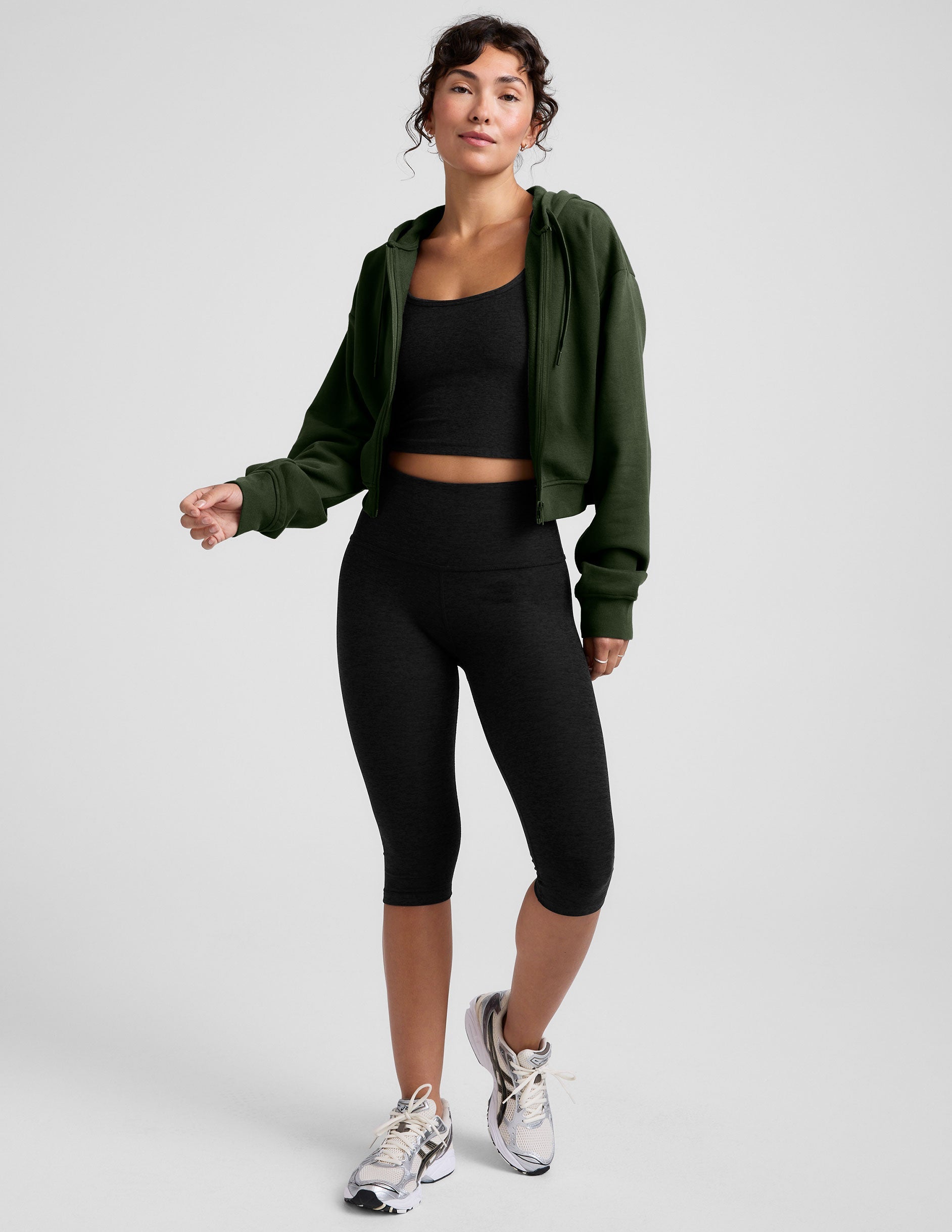 green fleece zip-up jacket with a drawstring hood.