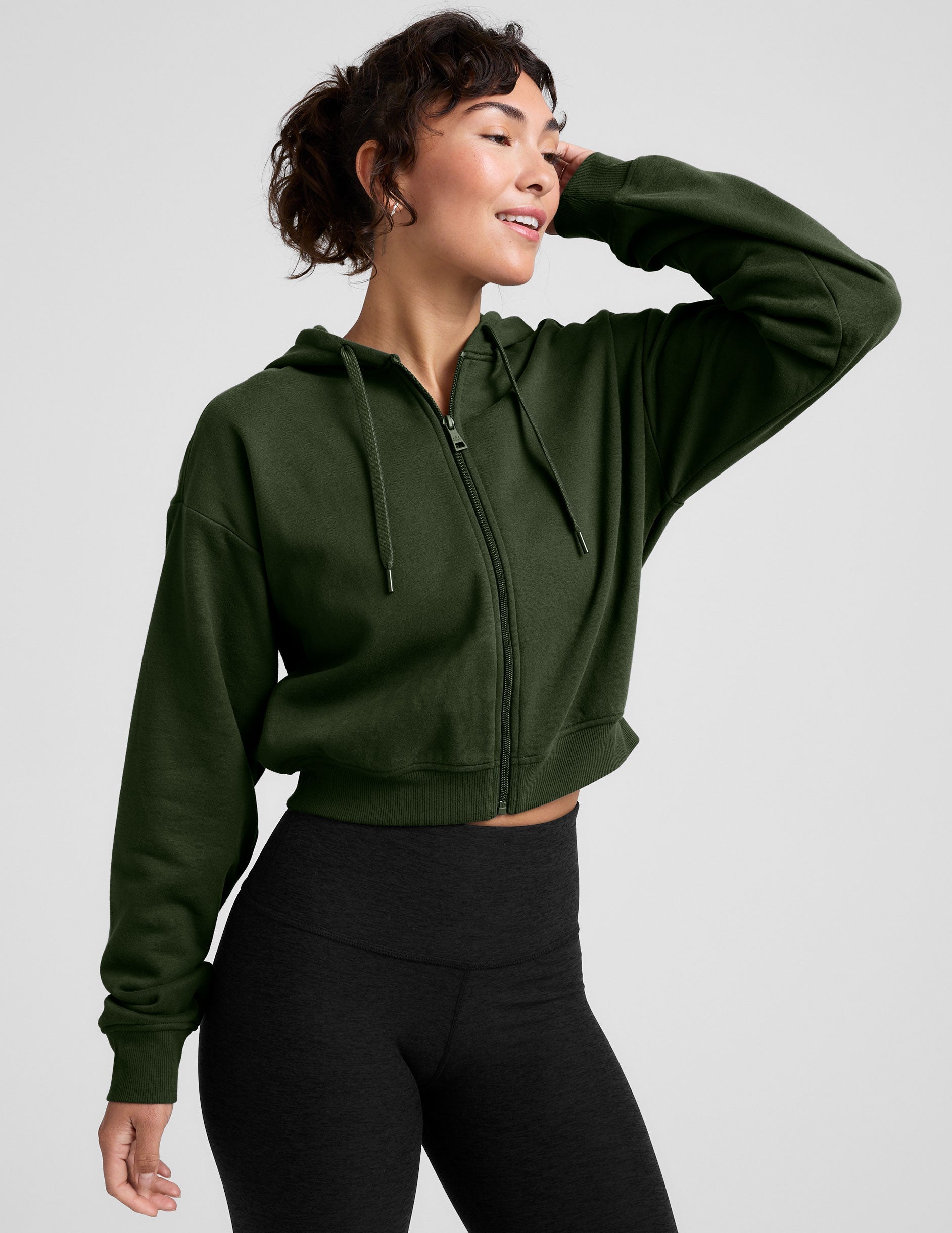 green fleece zip-up jacket with a drawstring hood.