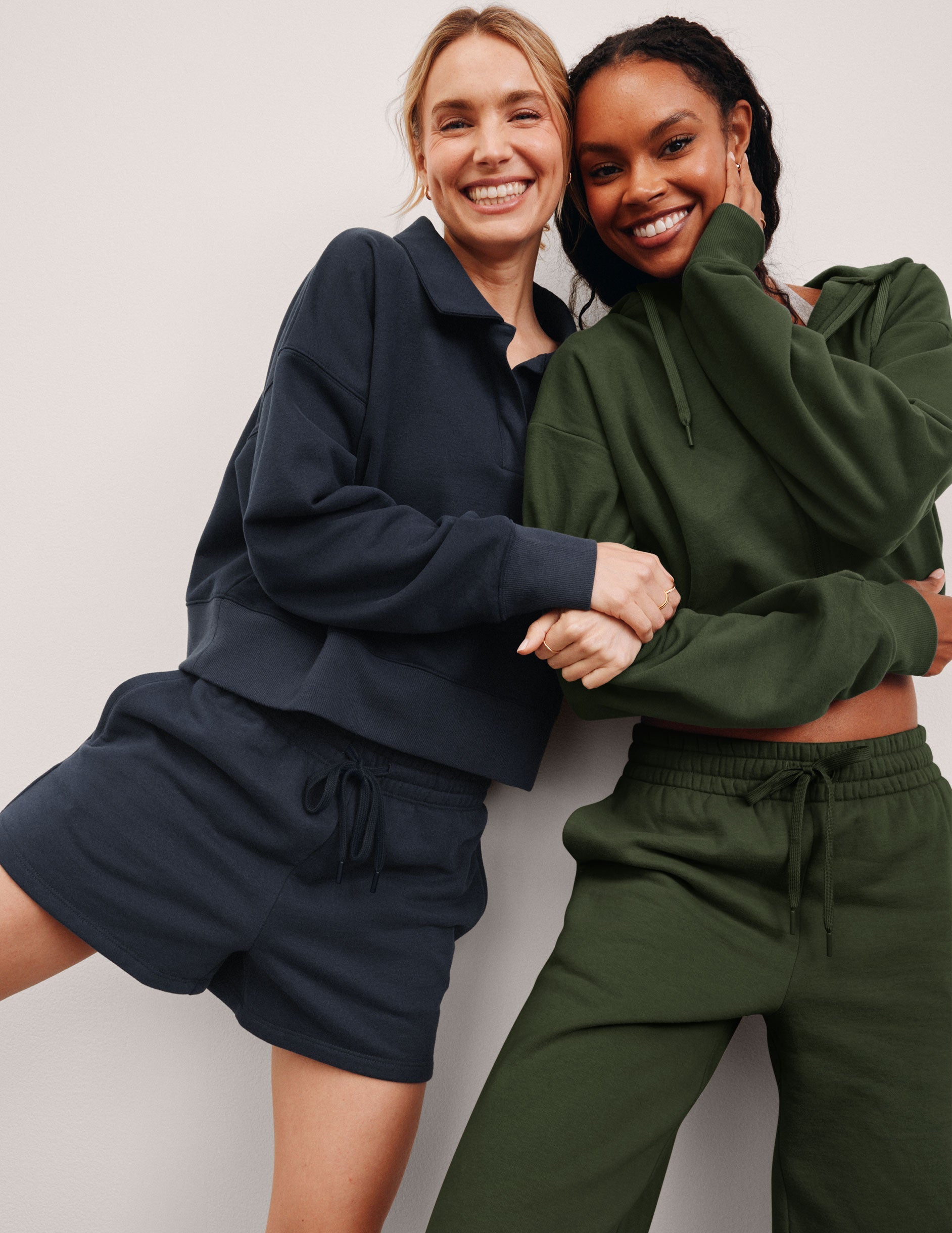 green fleece zip-up jacket with a drawstring hood.