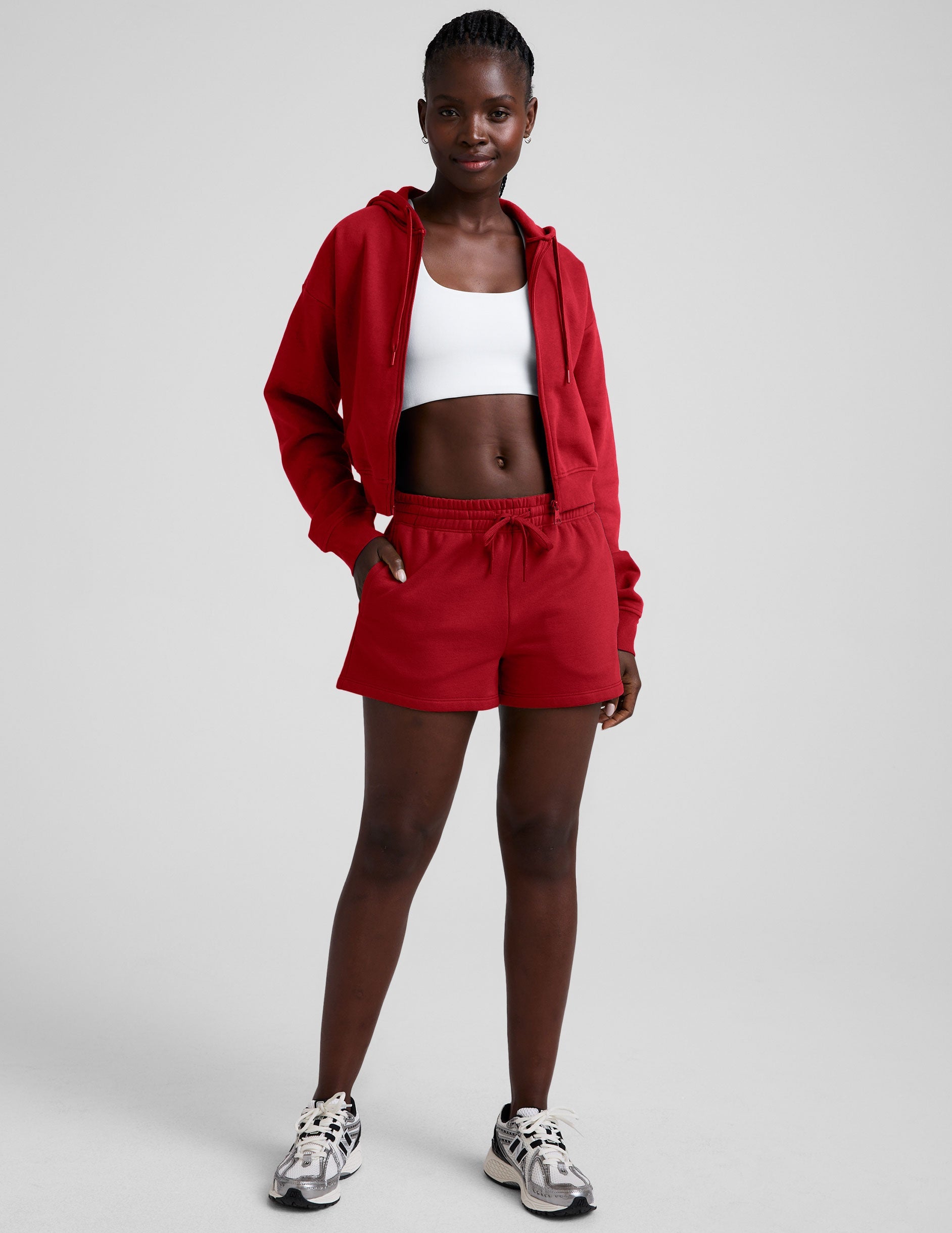 red fleece zip-up jacket with a drawstring hood.