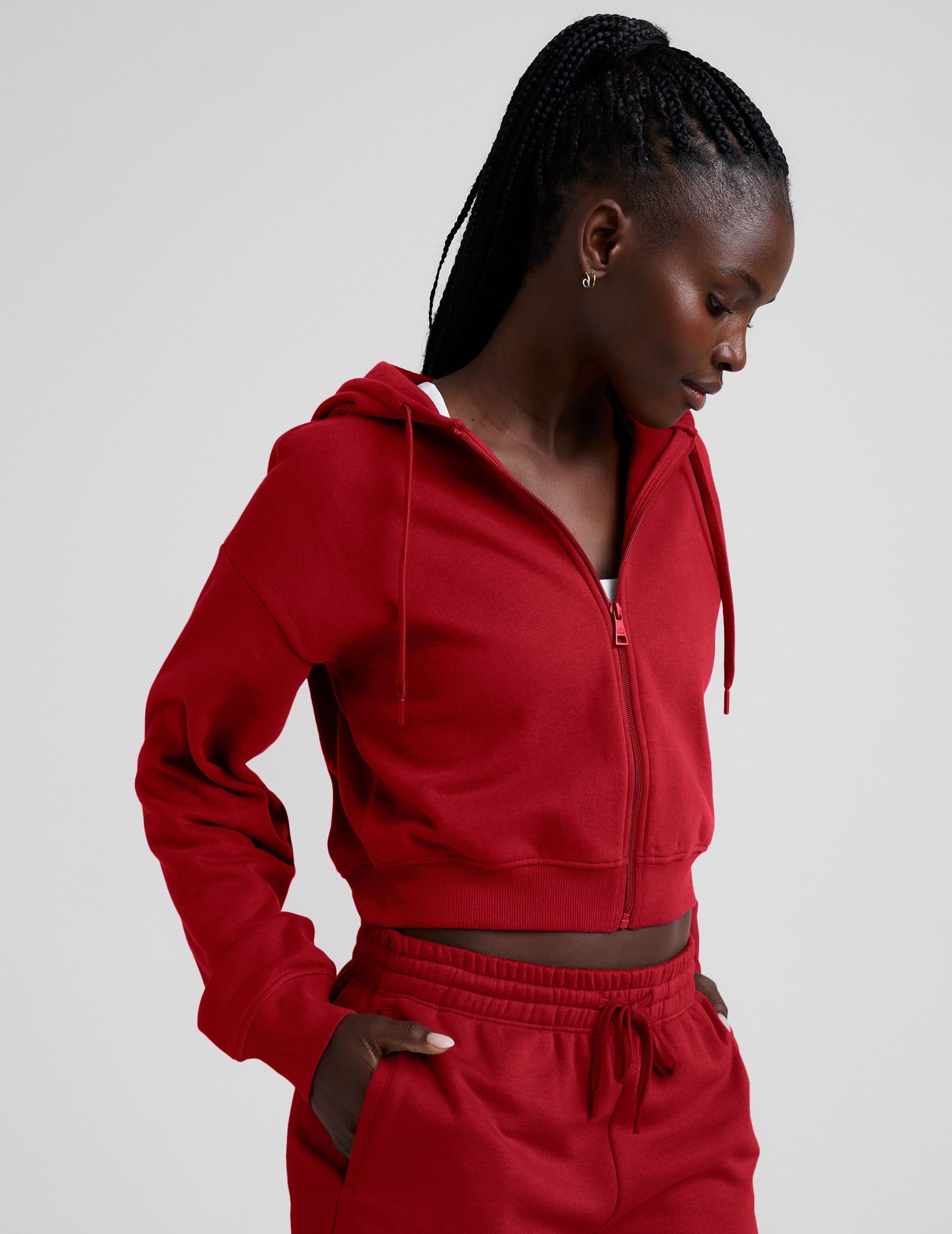 red fleece zip-up jacket with a drawstring hood.