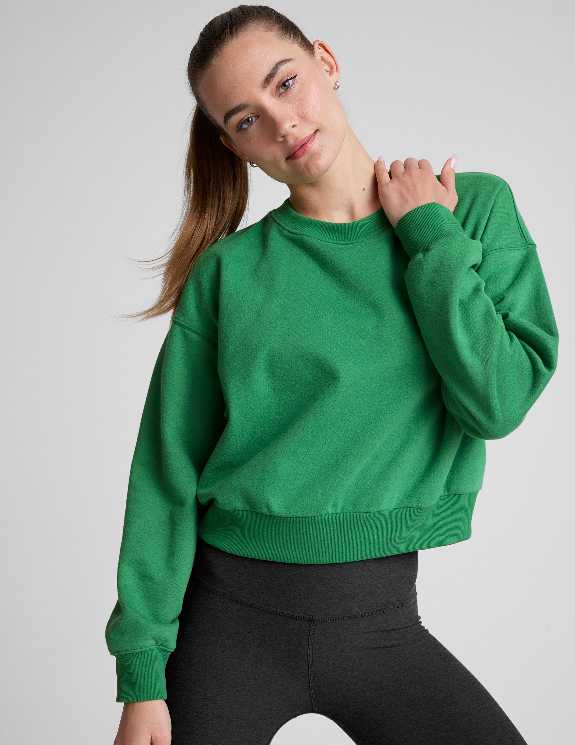 green crew neck sweatshirt.