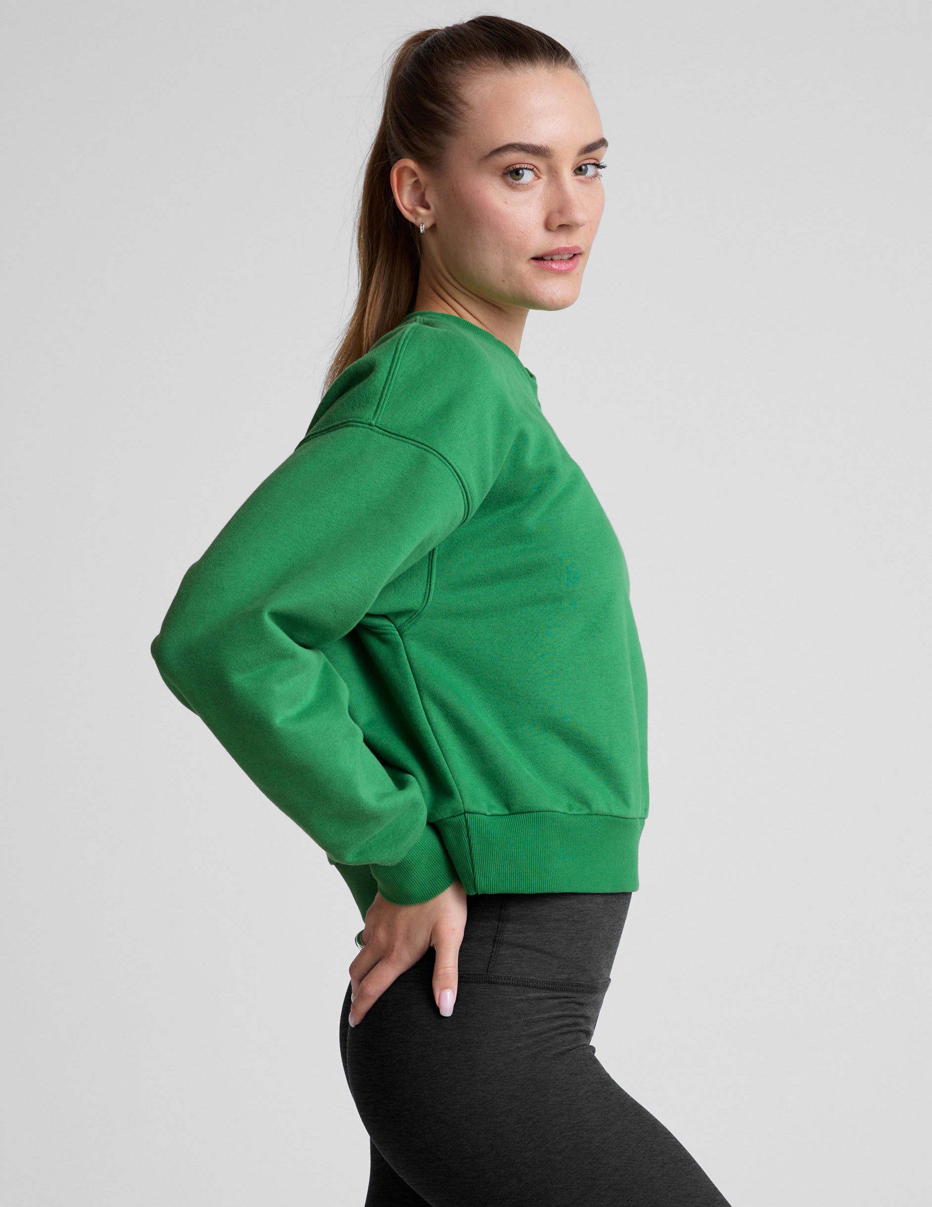 green crew neck sweatshirt.