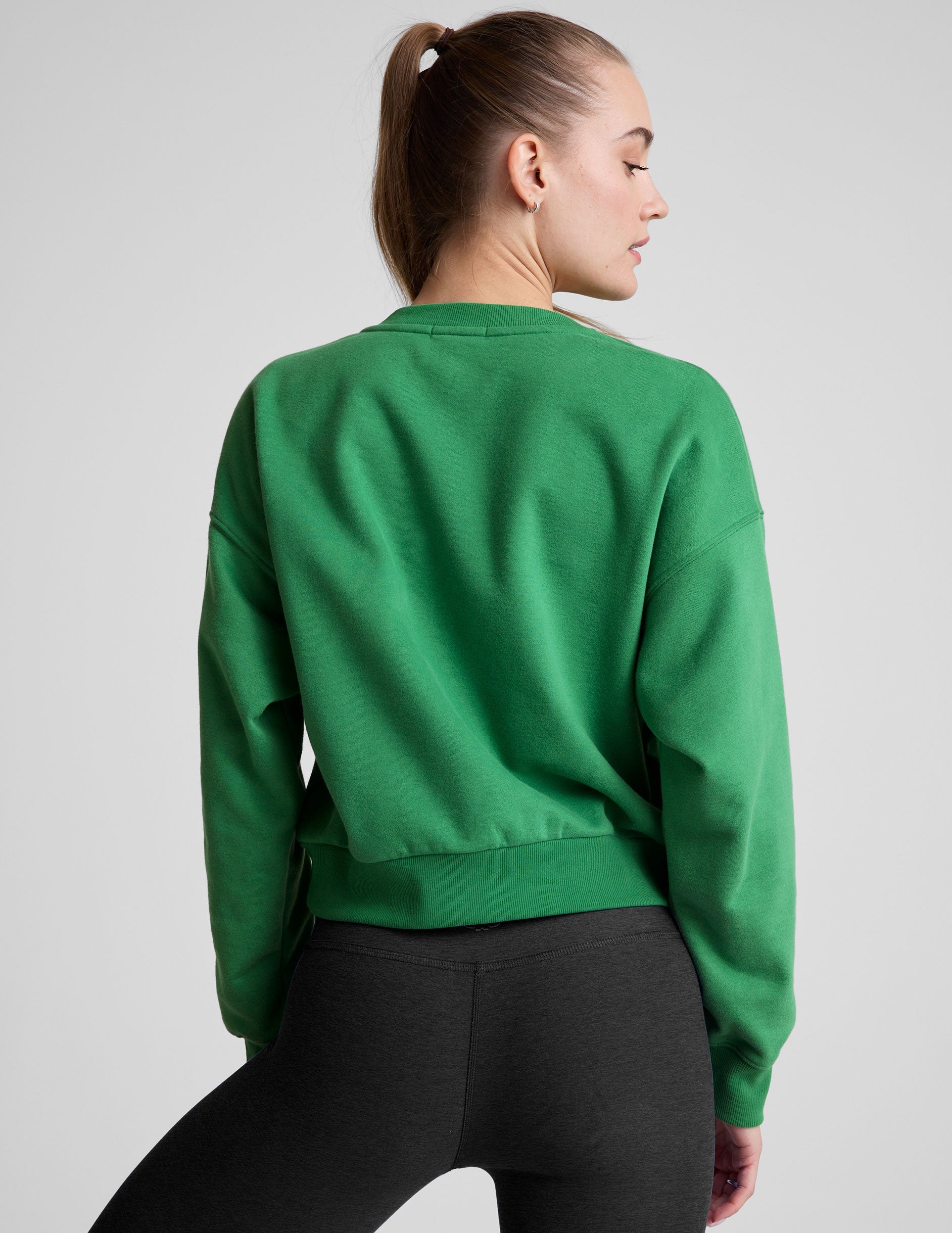 green crew neck sweatshirt.