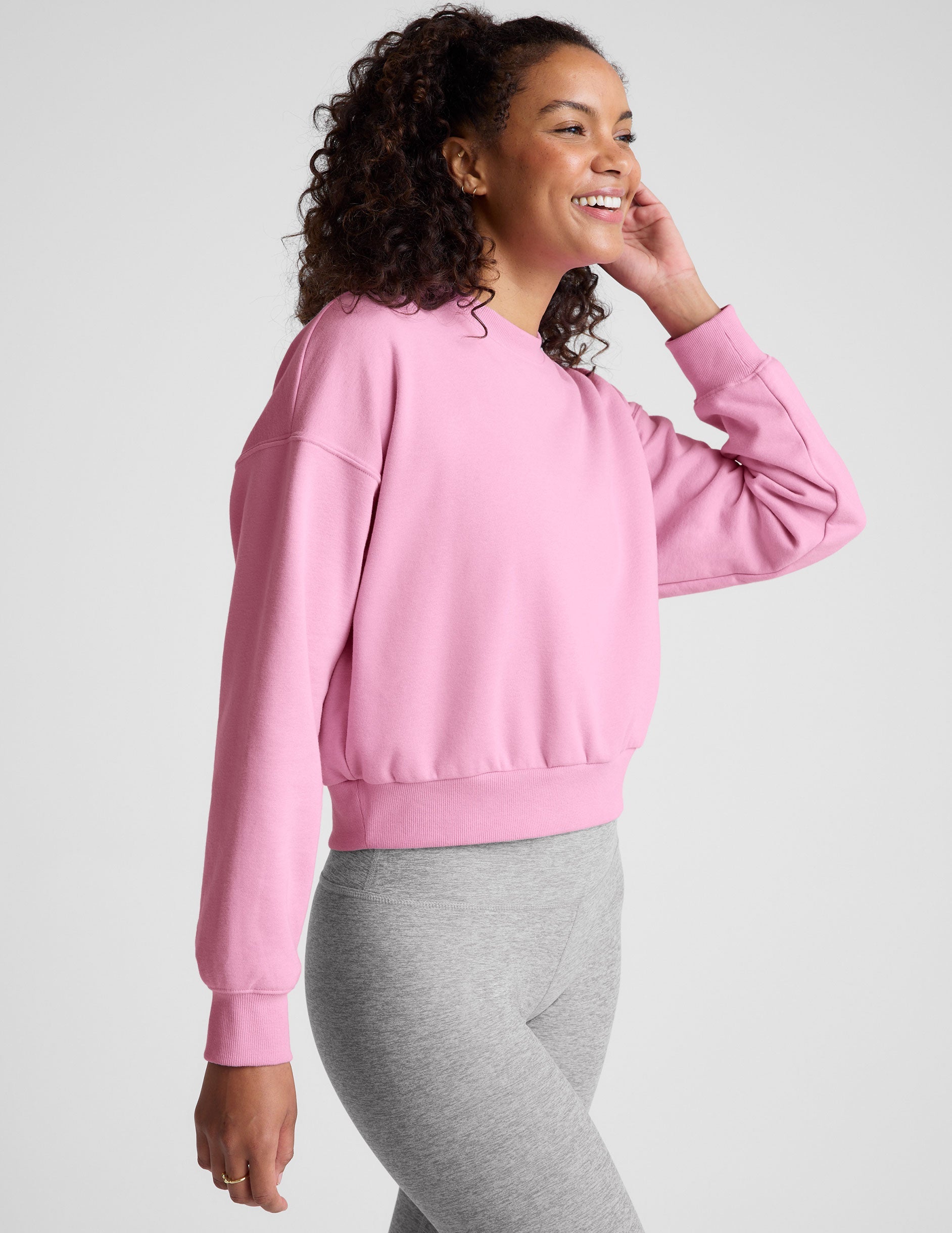 pink crew neck loose-fitting classic length sweatshirt.