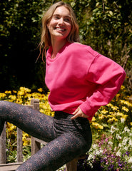 pink crewneck loose-fitting classic length sweatshirt.