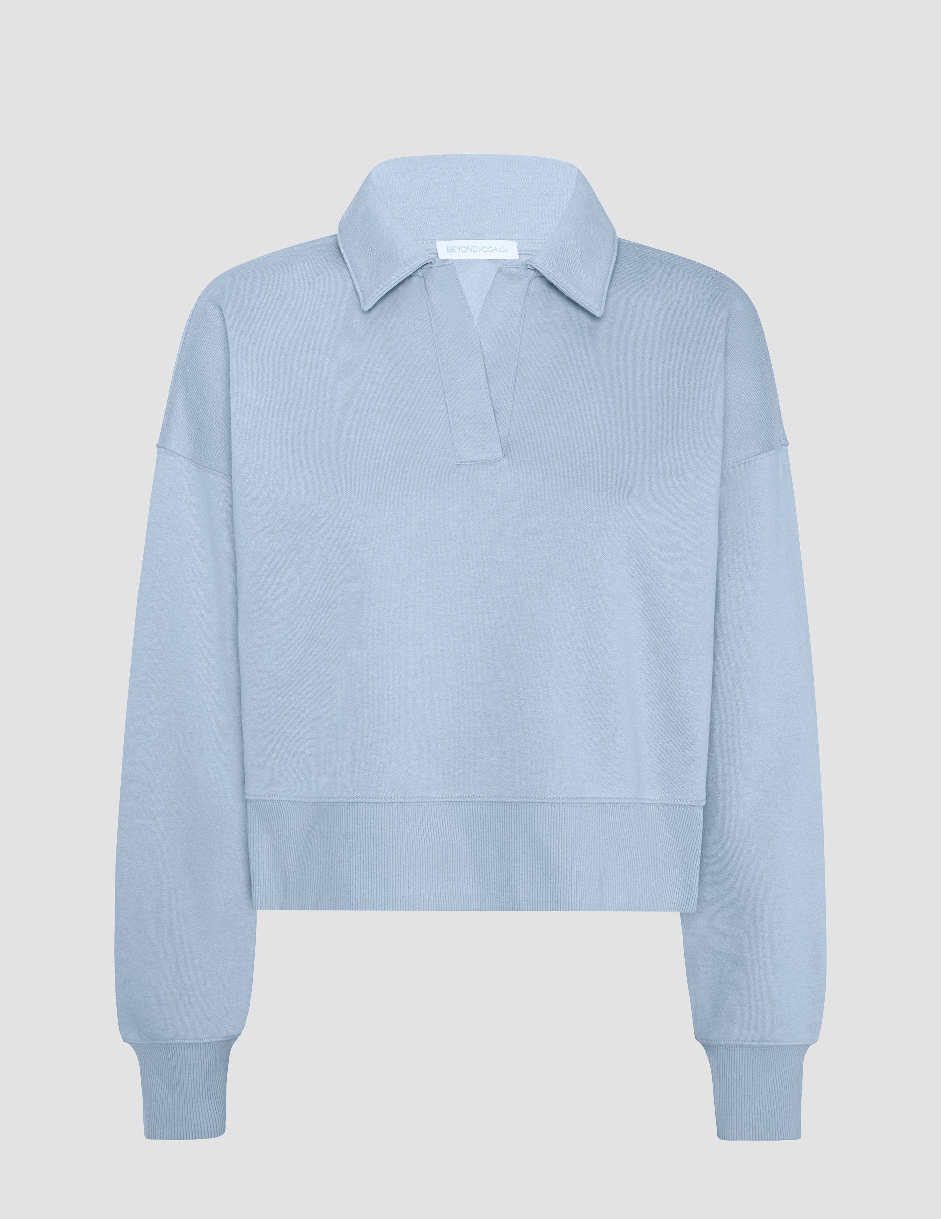 blue cropped long sleeve pullover with a v-neck collared neckline.