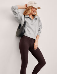 gray cropped long sleeve pullover with a v-neck collared neckline.