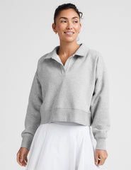gray cropped long sleeve pullover with a v-neck collared neckline.