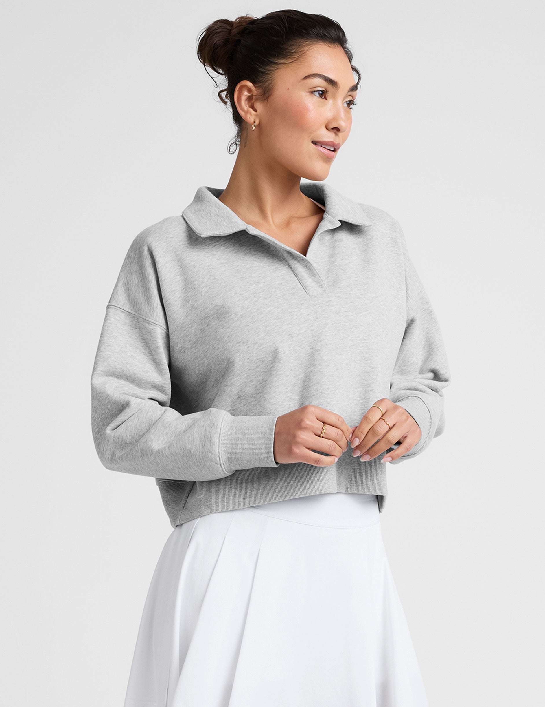 gray cropped long sleeve pullover with a v-neck collared neckline.