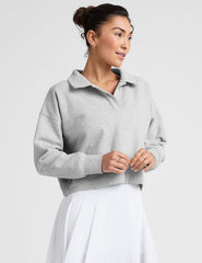 gray cropped long sleeve pullover with a v-neck collared neckline.