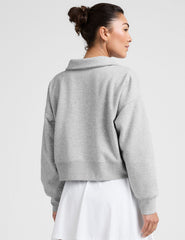 gray cropped long sleeve pullover with a v-neck collared neckline.