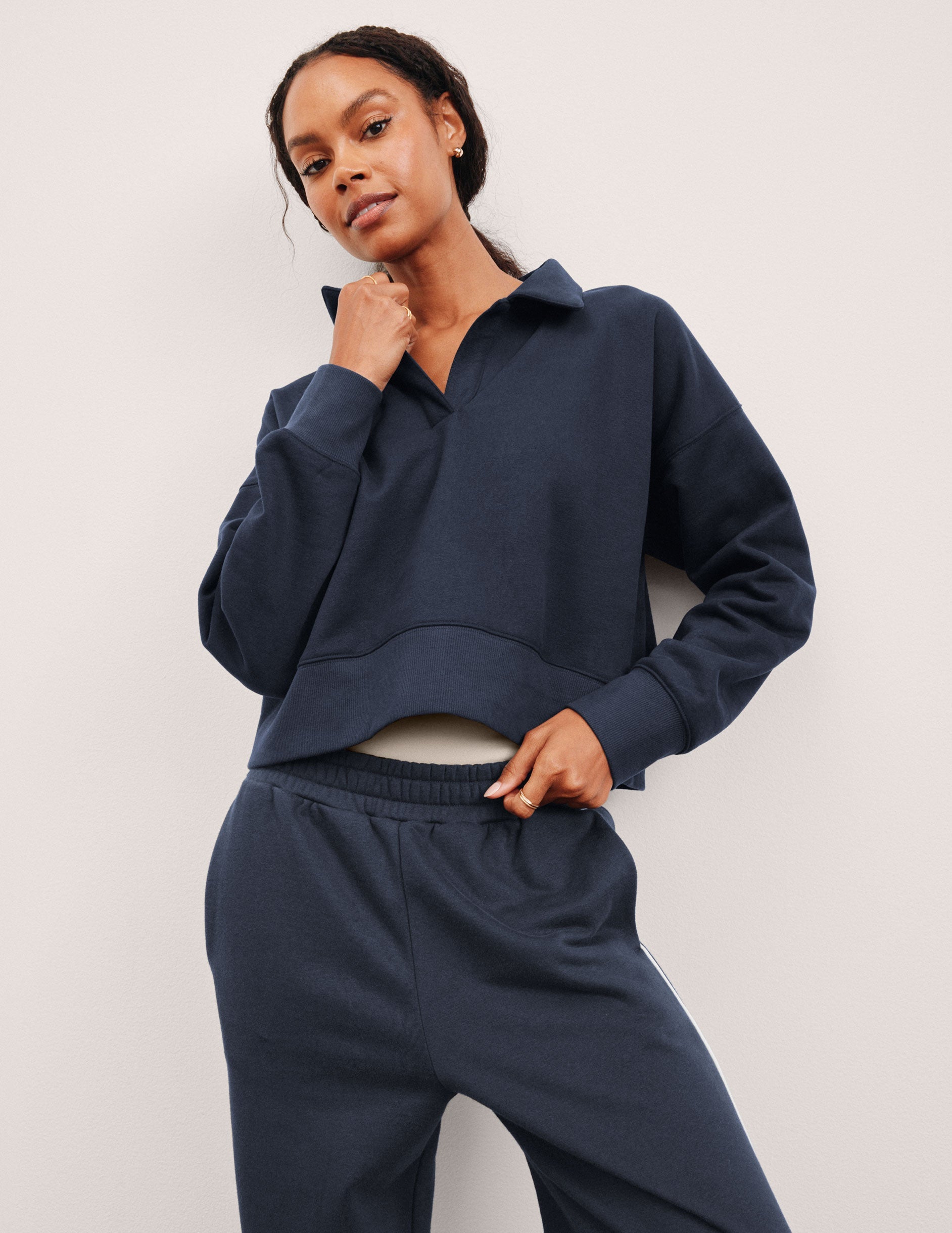 blue cropped long sleeve pullover with a v-neck collared neckline.